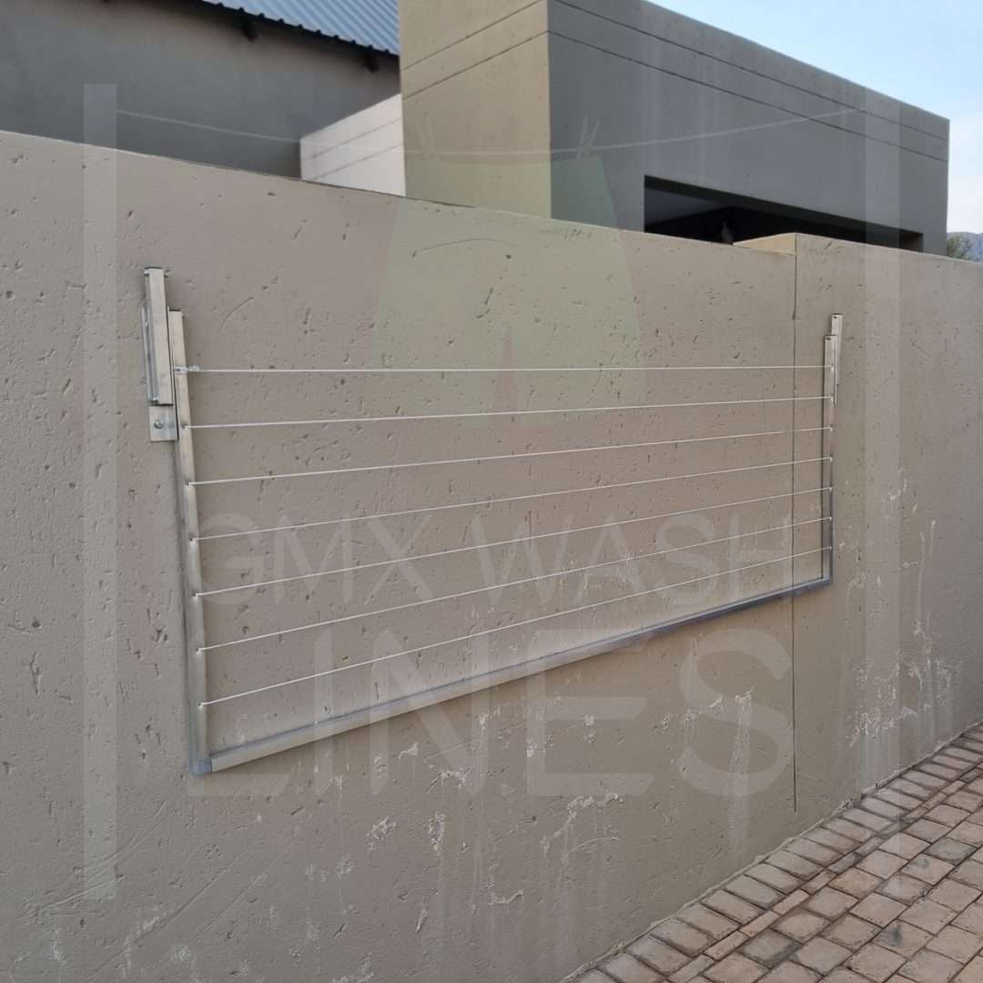 Rust-free aluminum fold away washing line affixed to an outdoor wall