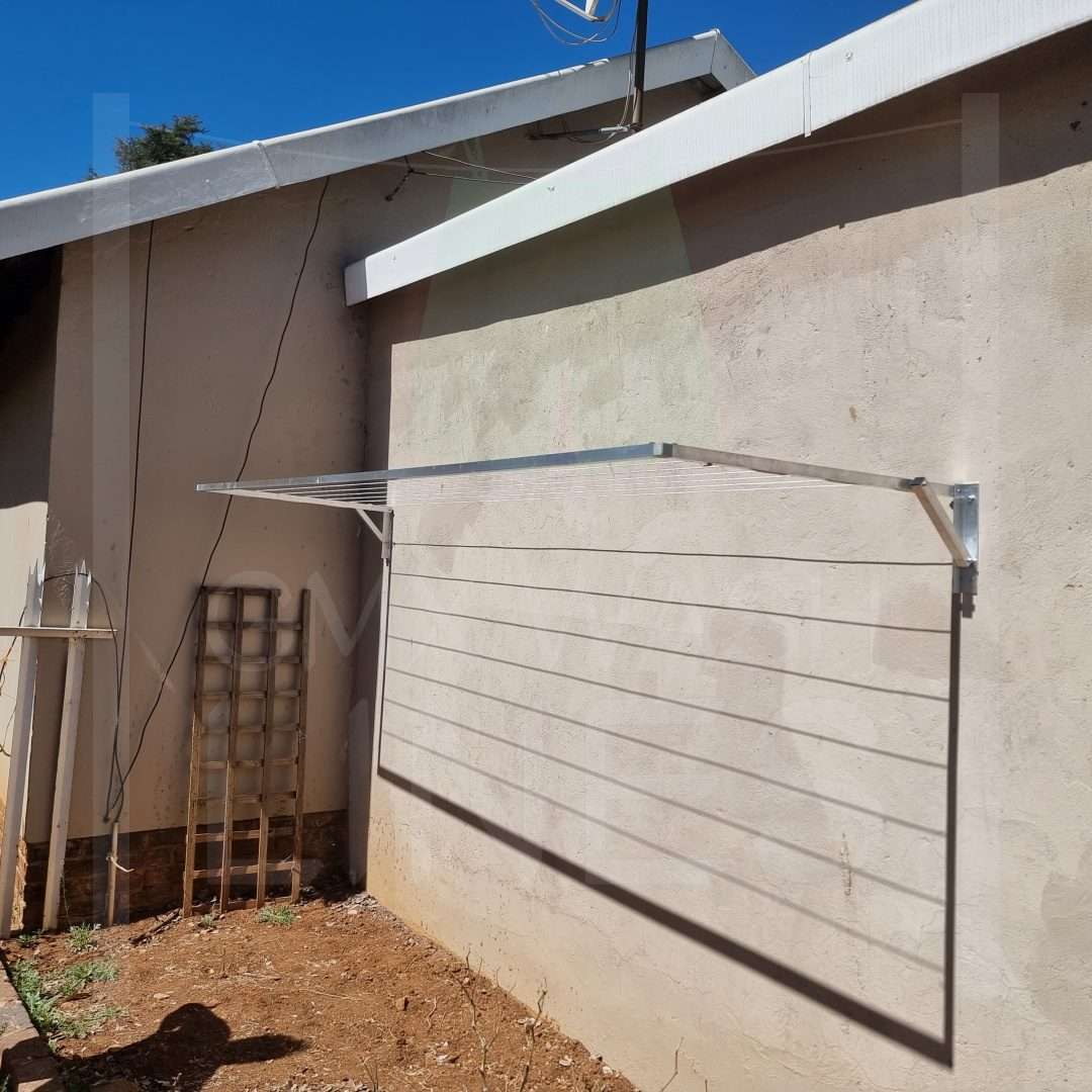 GMX wash line extended on a sunny day against a cream wall